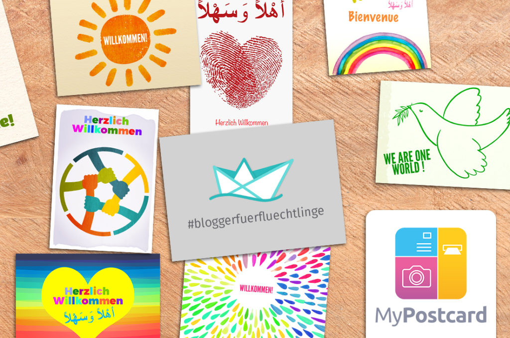 Über 1.000 Willkommenspostkarten nach Heidenau. Jetzt ist Hamburg dran – Blogger für Flüchtlinge Flatlay mit Postkartenmotiven von "Blogger für Flüchtlinge"